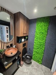 Green reindeer moss wall panel strip with dense textured surface