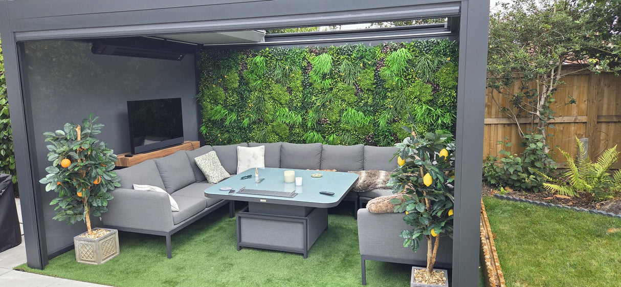 Artificial green foliage wall panel covering the outdoor wall, mixed leaves