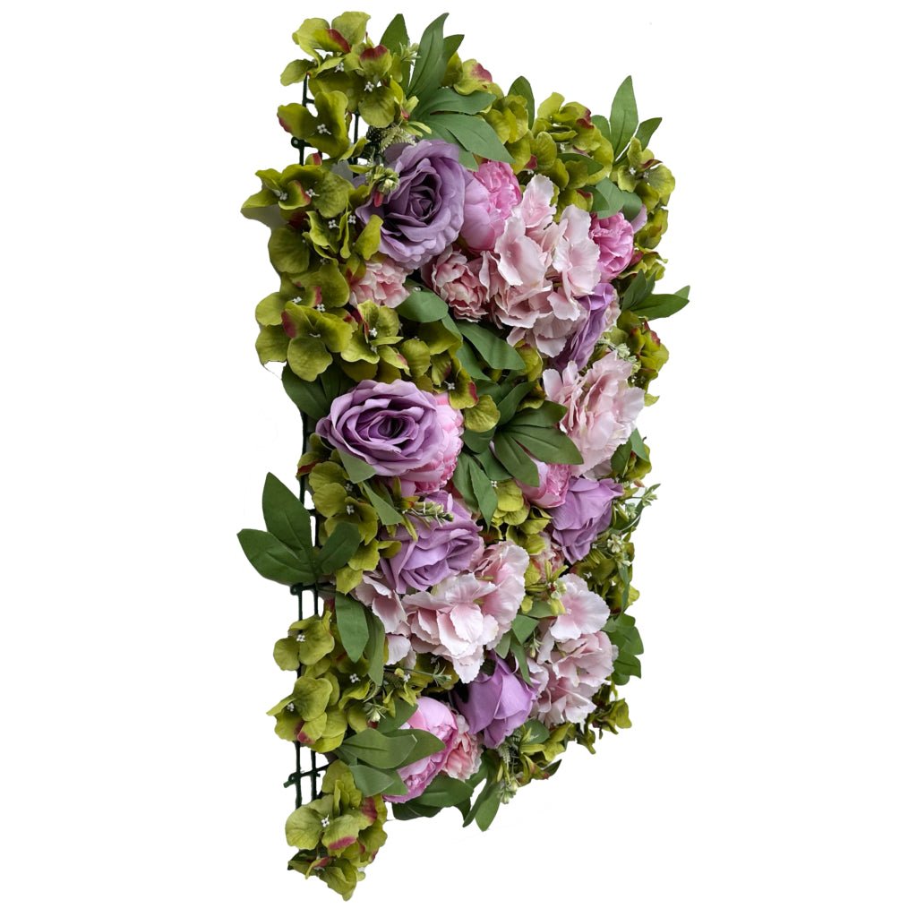 Flower mat with lilac and pink roses, peonies, hydrangea, and green foliage, vertical view