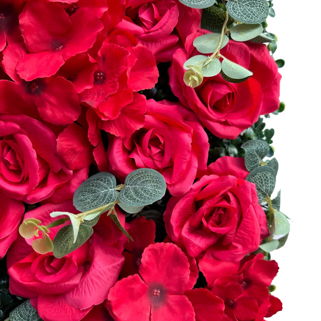 Red rose and hydrangea flower mat close-up with red blooms and green leaves