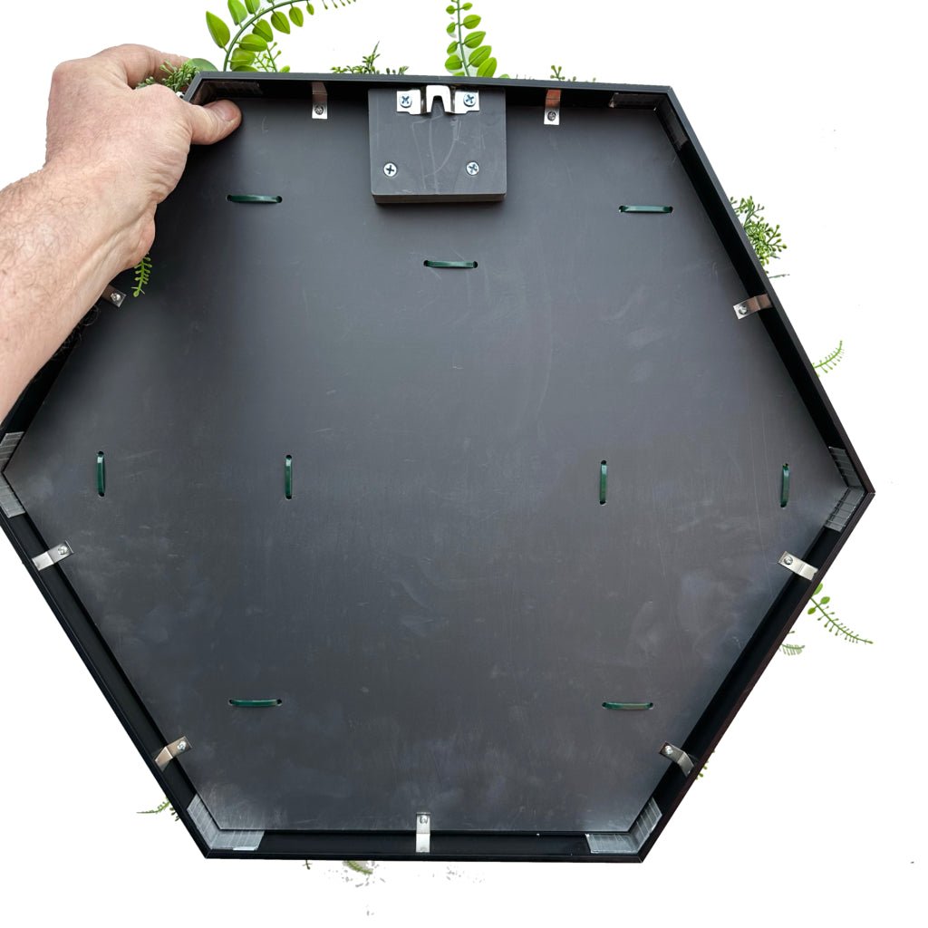 Hexagonal aluminum frame for artificial foliage, black backing with mounting clips.