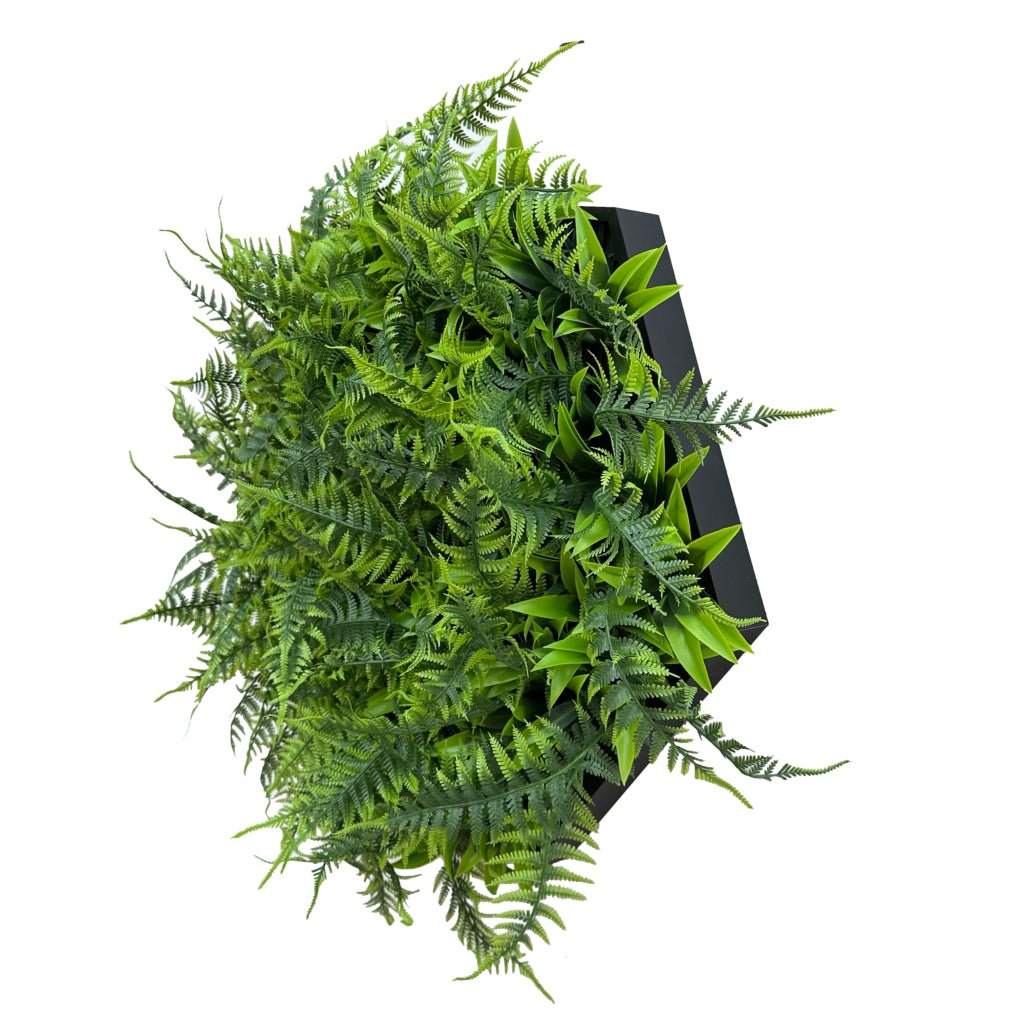Artificial green fern foliage in hexagonal aluminium frame, angled view.