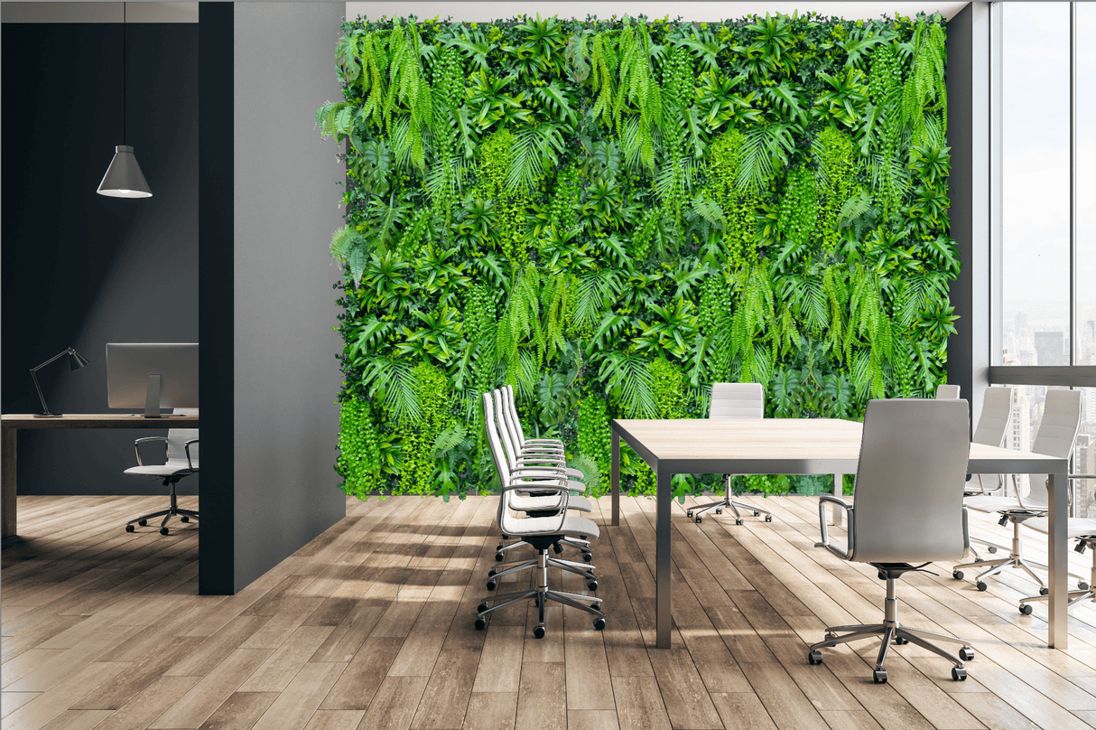 Artificial tropical plant wall with dense green leaves, vines, and rectangular display shape