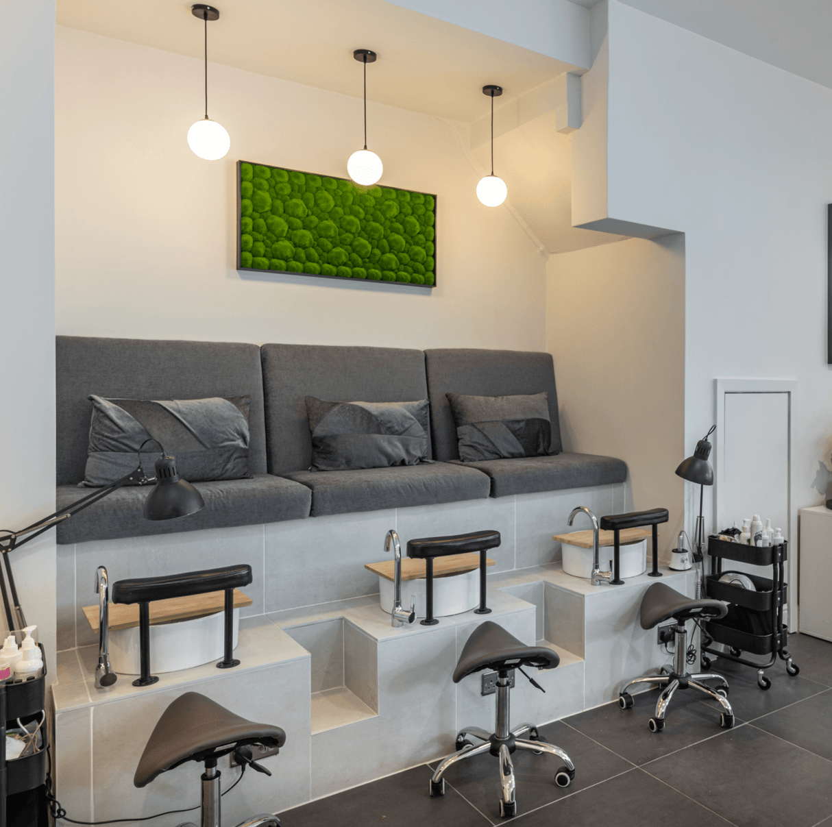 Two black-framed artificial moss wall art panels with green tufted rectangular patterns.