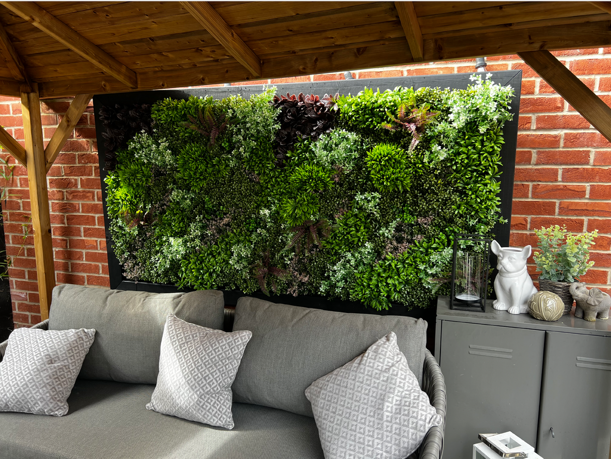 Artificial green wall panel with mixed green, burgundy and white tipped trailing plants 100x100 cm