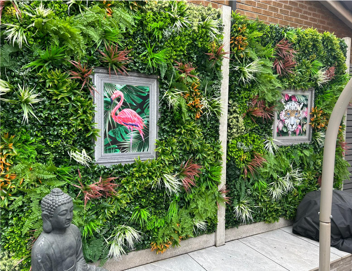 Artificial green wall panel with thick foliage texture and framed art inserts