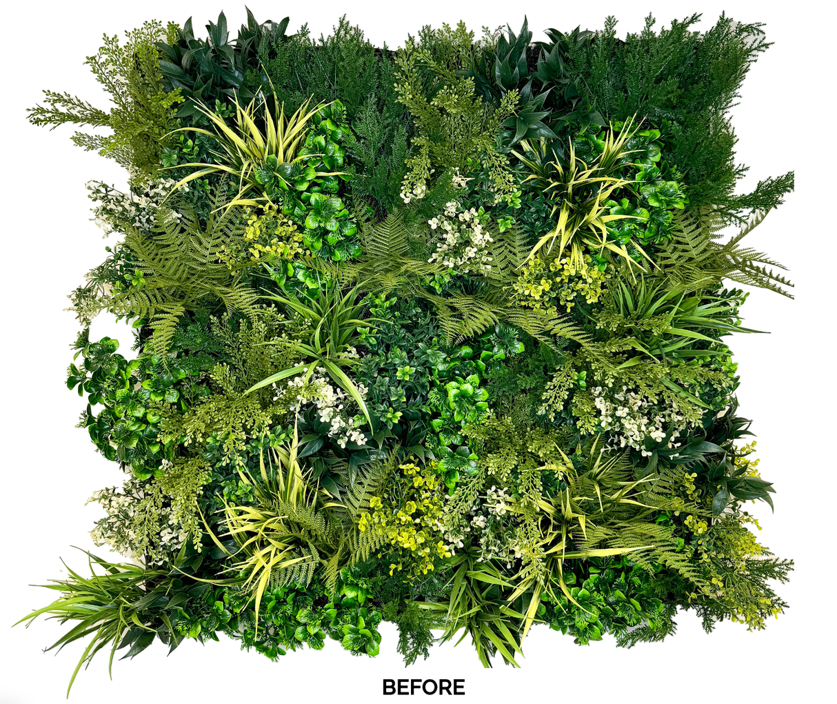 Artificial 3D plant wall panel featuring dense mixed green foliage and small white flowers