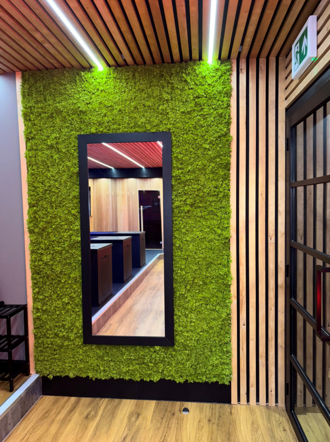 Artificial green moss wall panel with rectangular framed opening