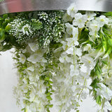 Hanging hoop with a mixture of artificial green plants with white trailing flowers 60cm diameter