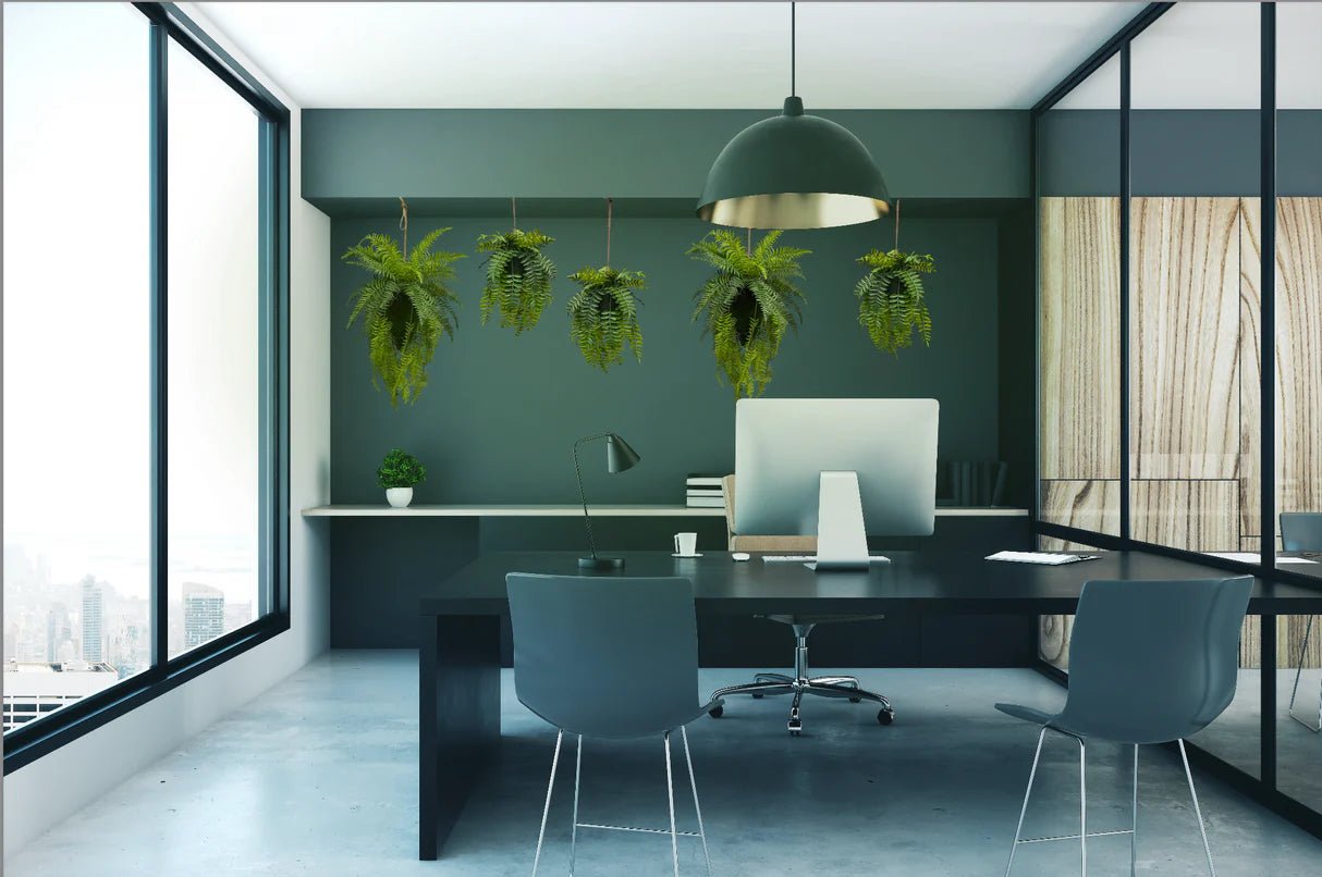 Artificial trailing fern kokedama with small hanging green fern fronds from twine