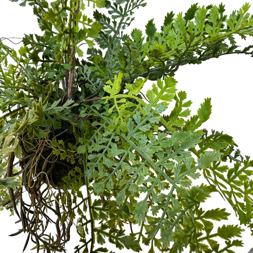 Artificial hanging fern kokedama with dense green foliage and dark moss base