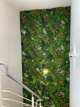 Artificial green wall panel with mixed green orange red and white foliage, white and yellow flowers 100x100 cm