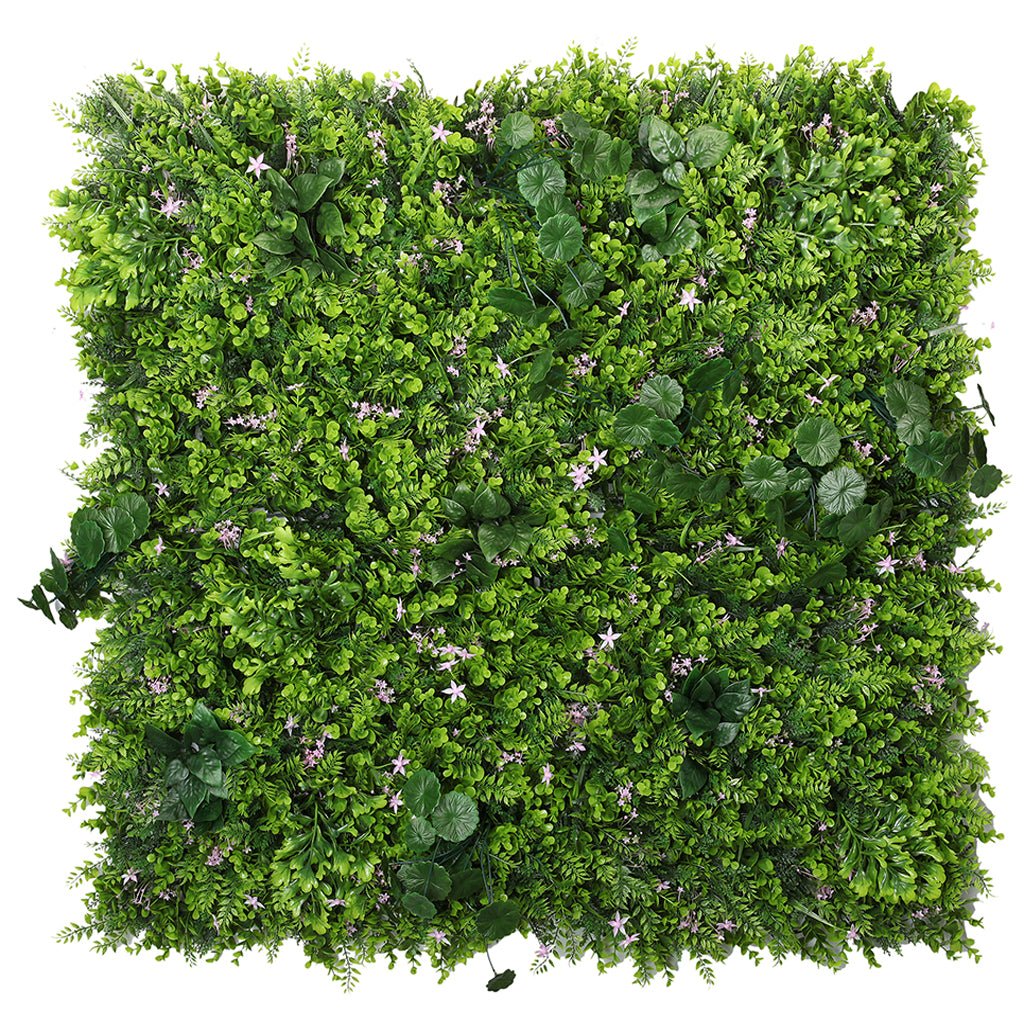 Artificial green plant wall panel with dense mixed leaves and scattered small pink blooms