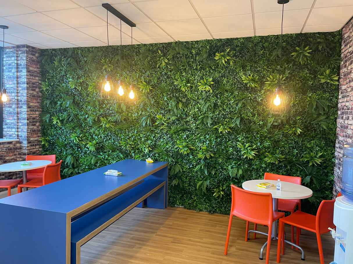 Artificial green wall panel with variegated foliage ivy palms grasses and ferns 100x100 cm