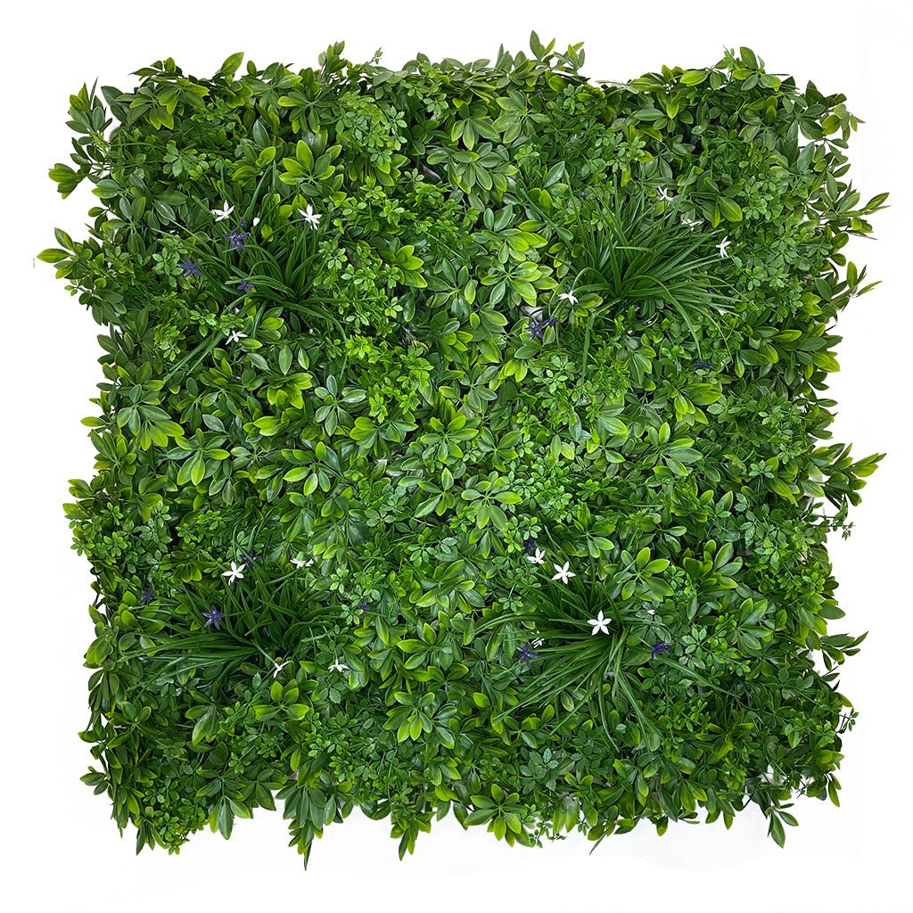 Artificial green foliage wall panel with mixed leaves and small purple and white flowers
