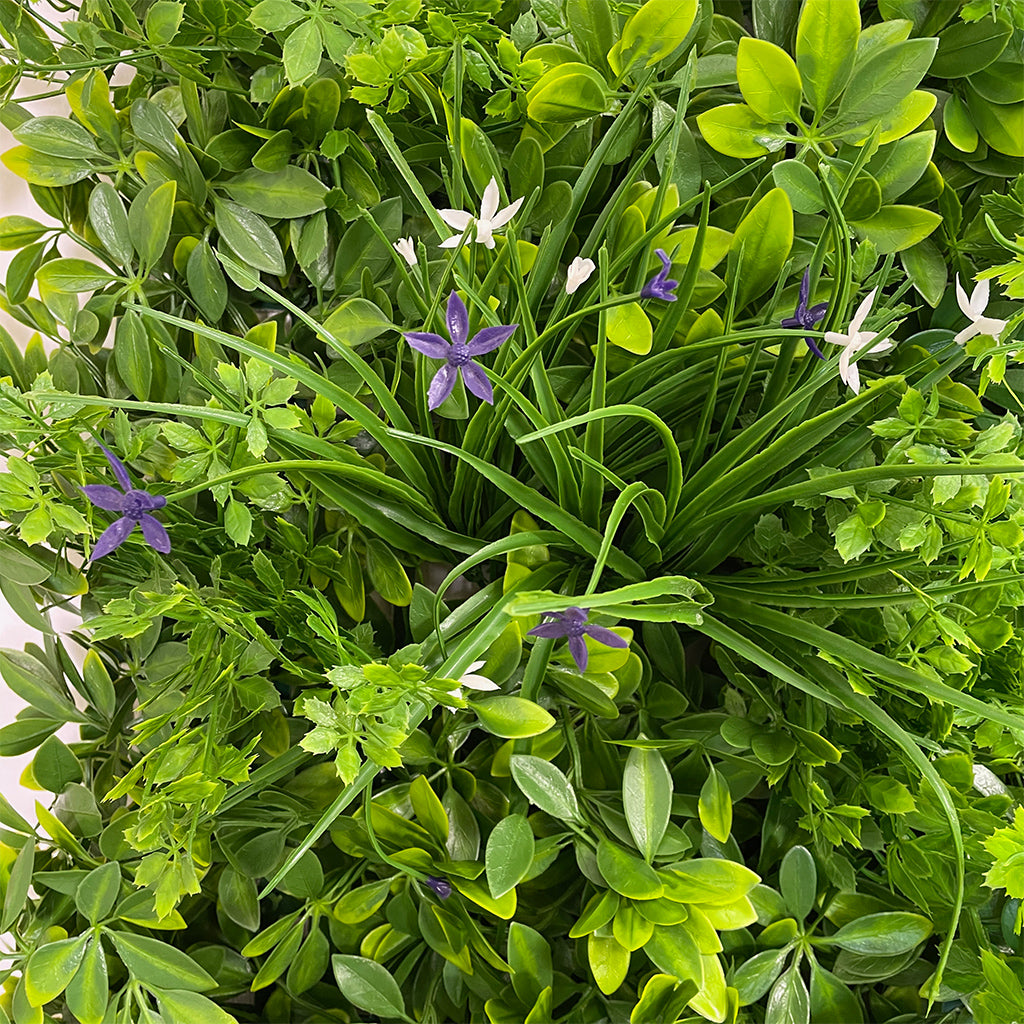 Artificial green wall panel with mixed 3d light-dark green foliage with purple & white flowers 100x100 cm