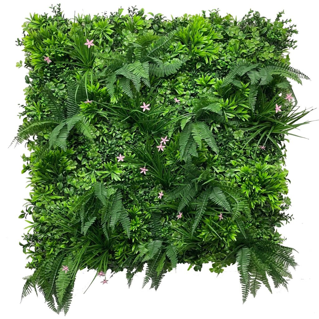 Artificial green wall panel with layered greenery and scattered pink flowers
