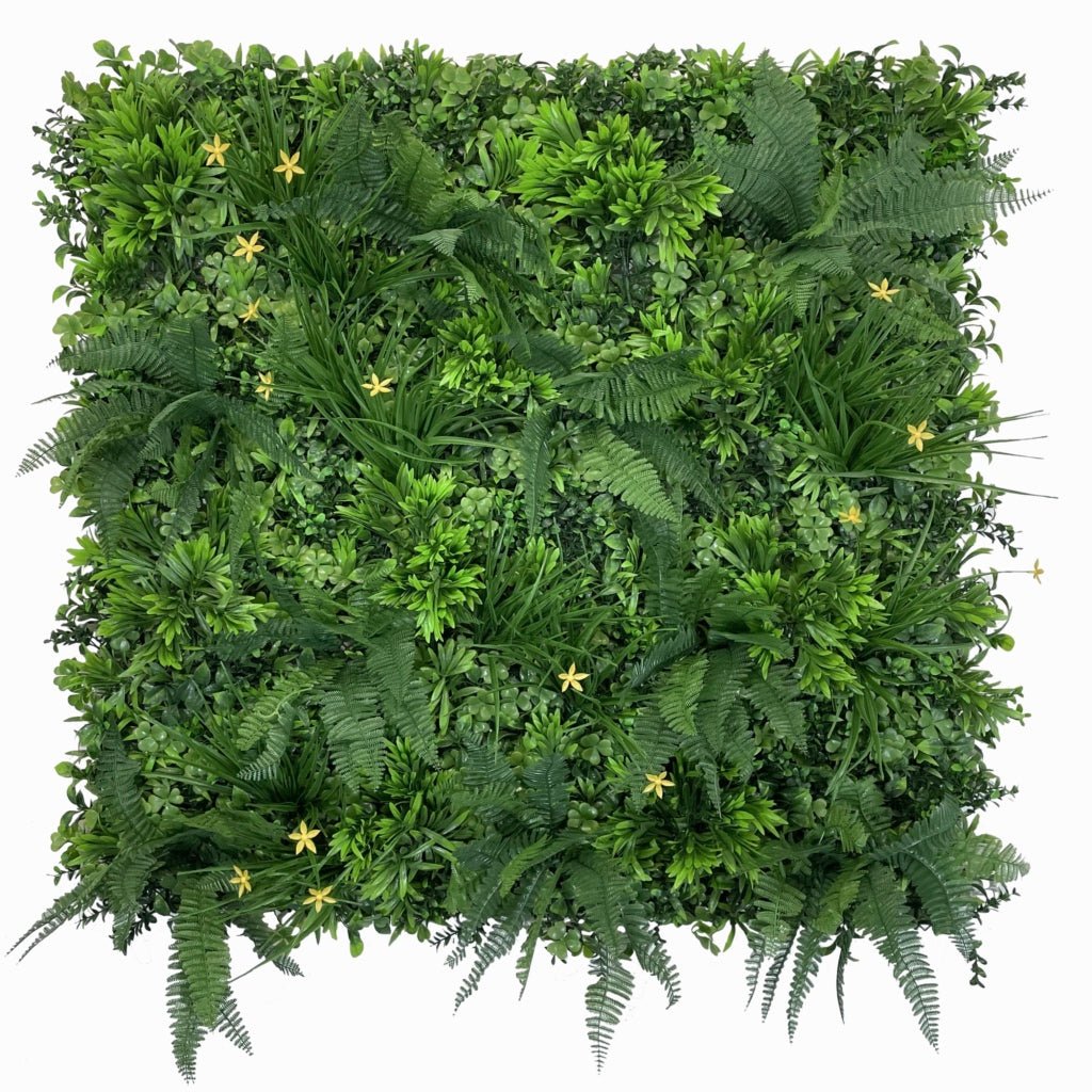 Artificial green foliage wall panel with mixed greenery and small yellow star flowers
