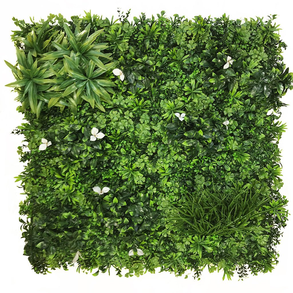 Artificial green foliage wall panel with dense leaves and small white flower accents