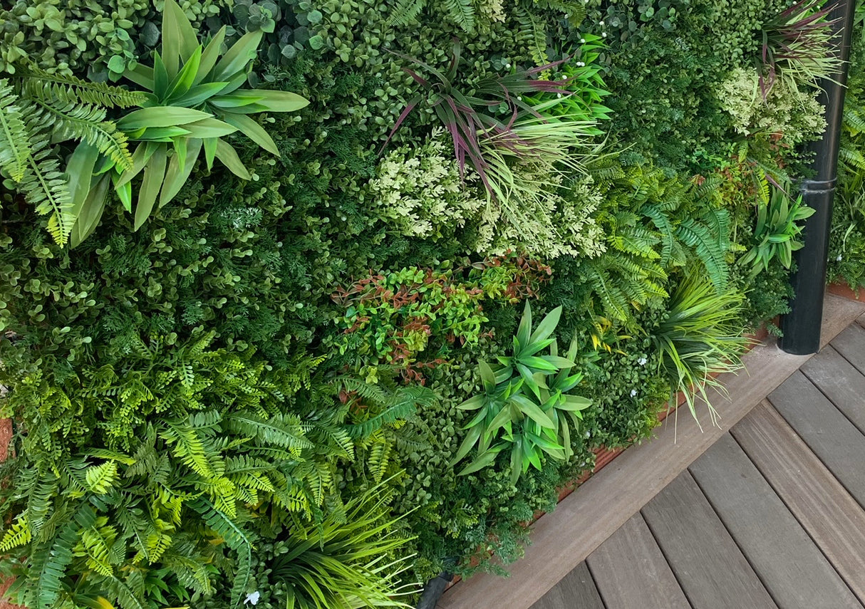 Artificial green wall panel GW74B with variegated mixed green yellow red white foliage 100x100 cm