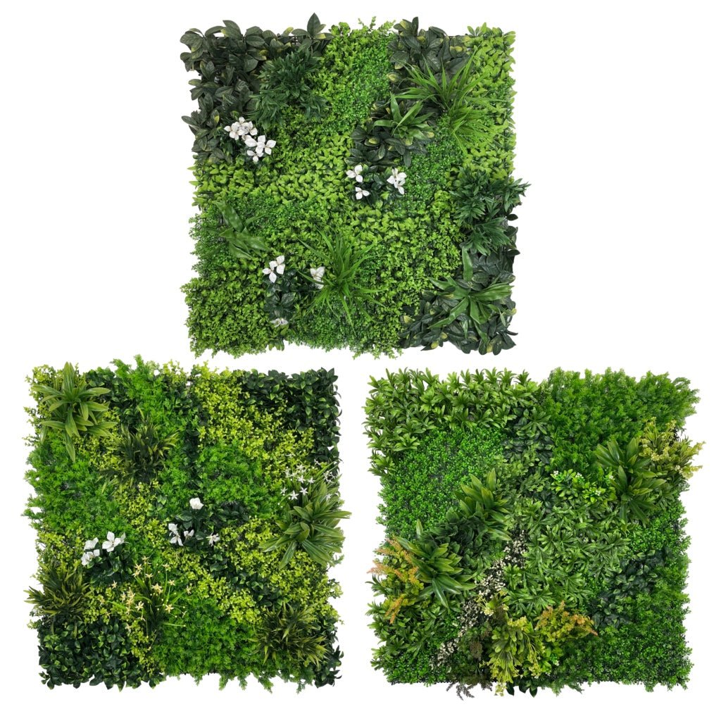 Set of three artificial green foliage wall panels with white flowers
