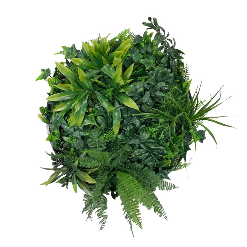 Artificial green foliage circular wall panel with mixed leaf shapes