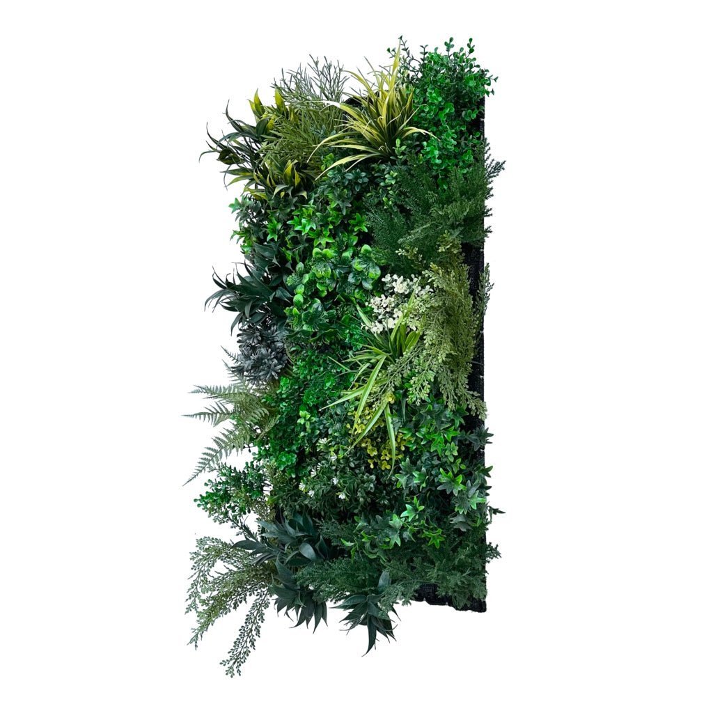 Artificial 3D plant wall panel angled view with lush dark and bright green foliage