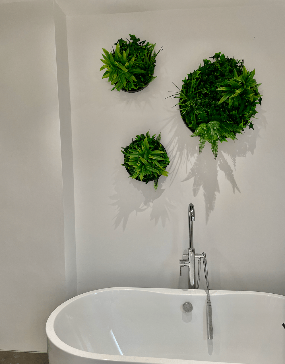 Set of green foliage circular wall art panels with dense leaf texture