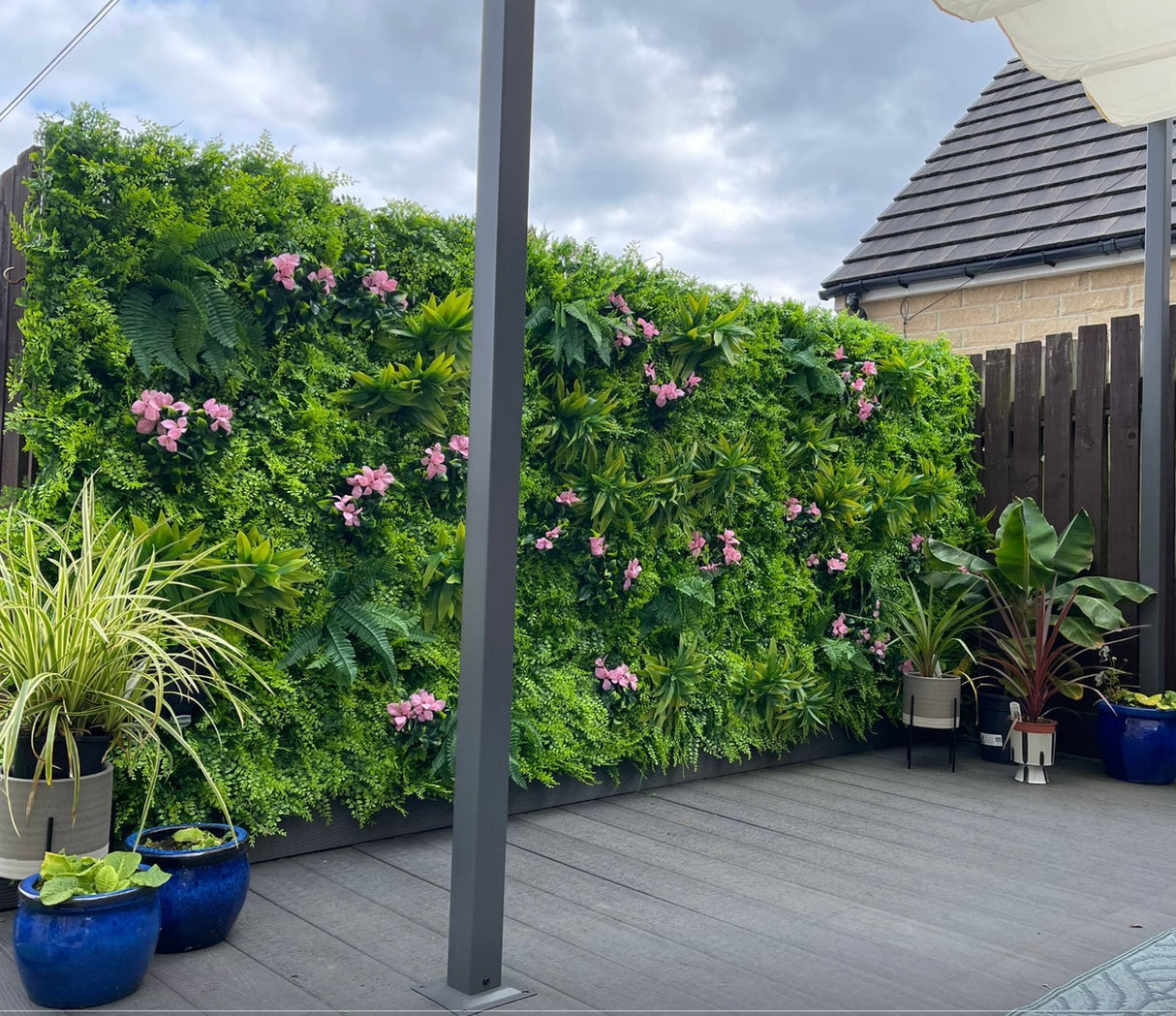 Artificial green wall panel with  ferns palms and pink flowers 100x100 cm