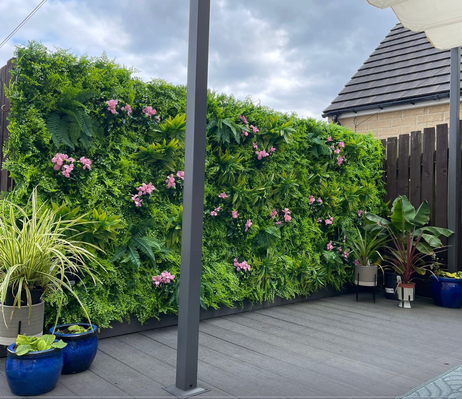 Artificial green wall panel with  ferns palms and pink flowers 100x100 cm