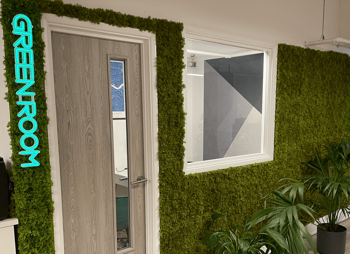 Artificial moss panel wall section with dense bright green foliage