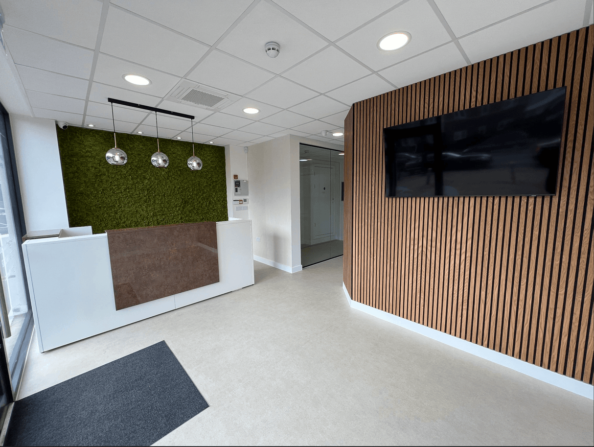 Artificial green moss panel wall covering with framed brown insert