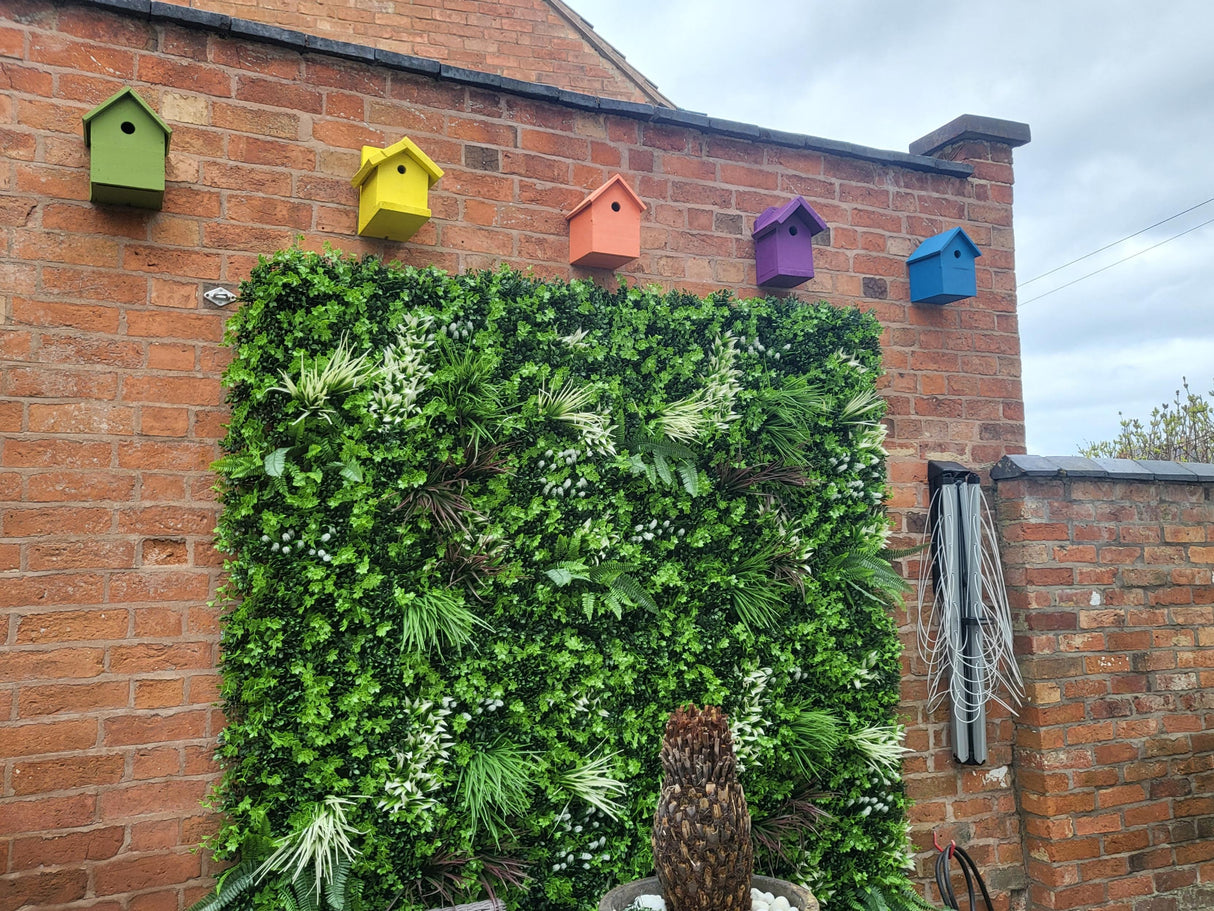 Artificial green wall panel with mixed green orange red and white foliage, white and yellow flowers 100x100 cm