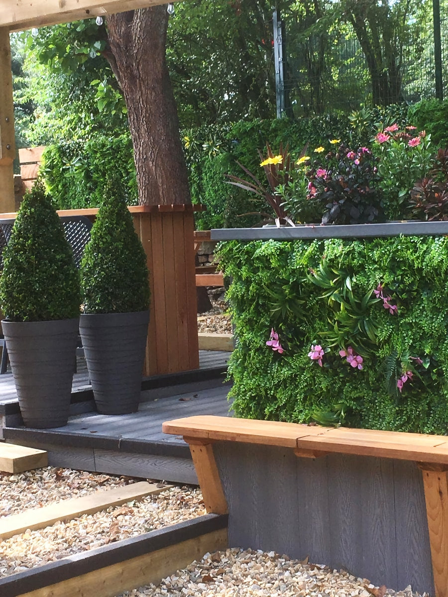 Artificial green wall panel with  ferns palms and pink flowers 100x100 cm