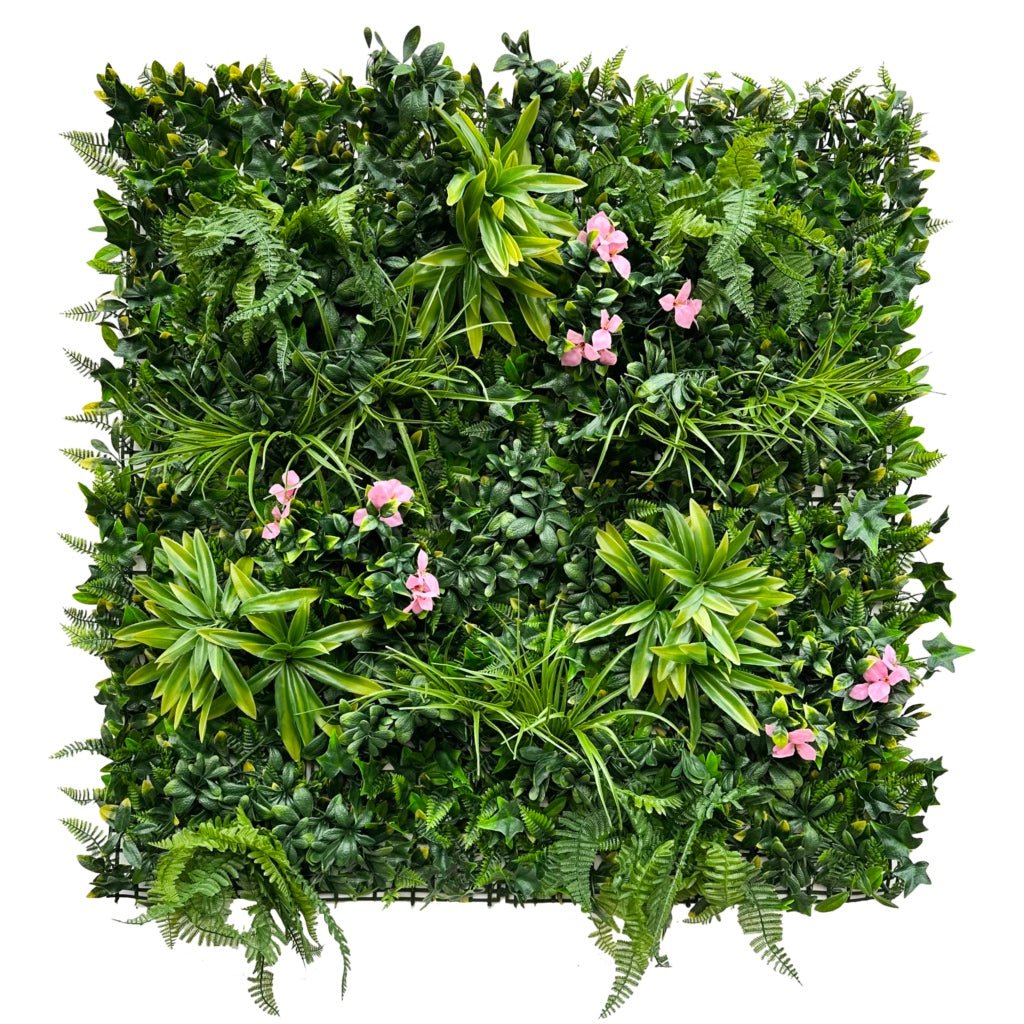 Artificial green wall panel with mixed foliage and small pink flowers