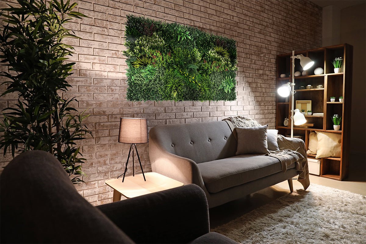 Artificial green foliage wall panel with dense mixed green leaves and light accents