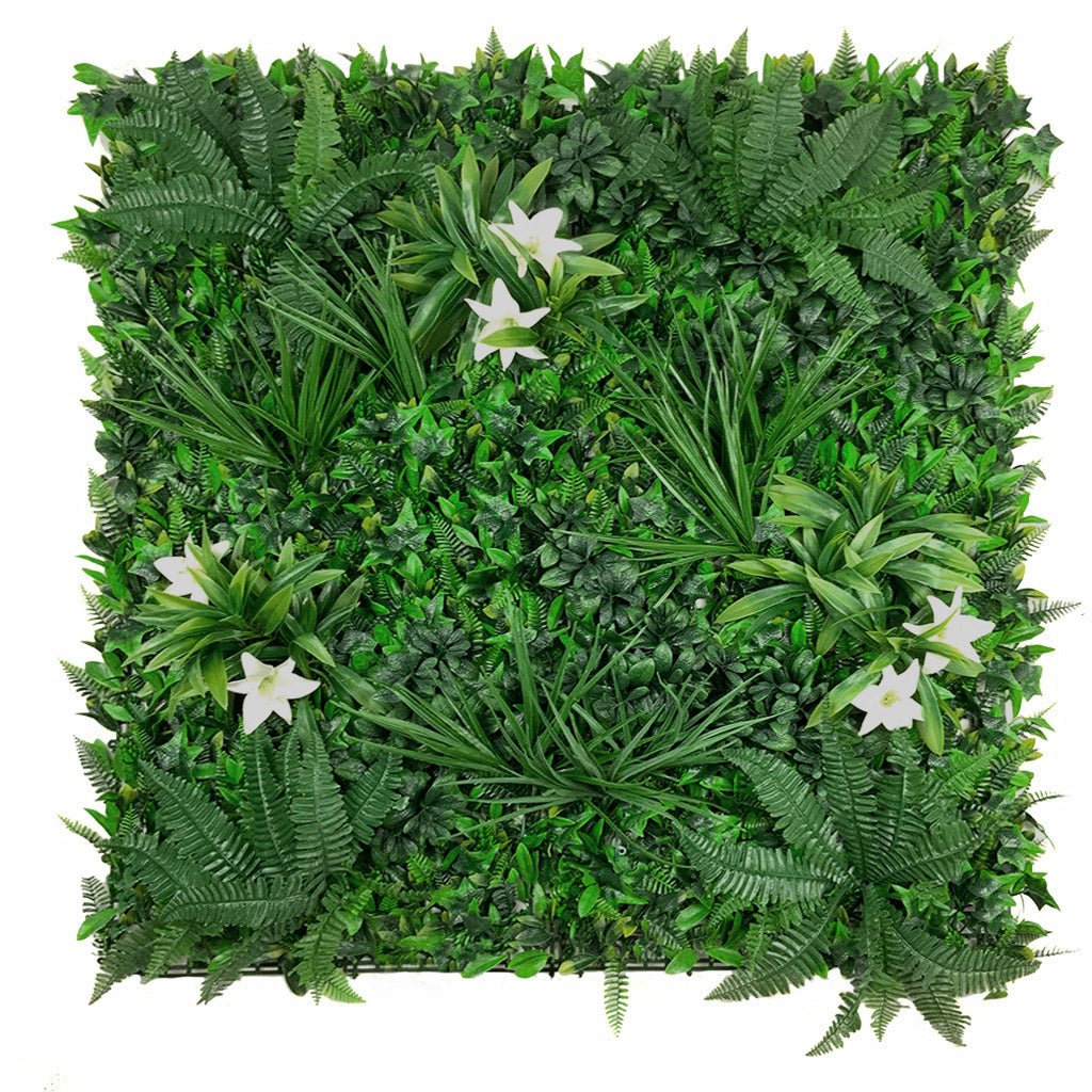 Artificial green wall panel with white lily flowers and dense leafy foliage, full view