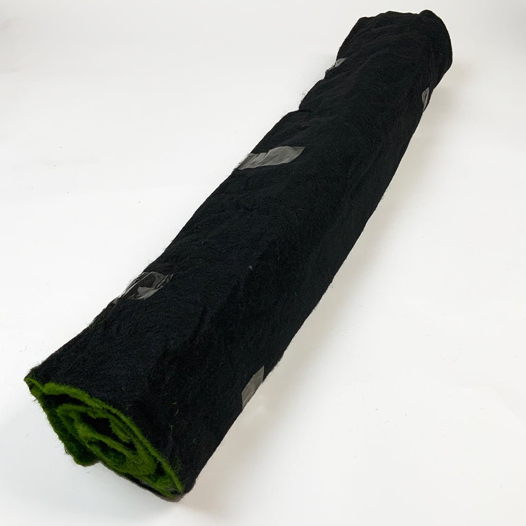 Artificial green moss panel roll with black fabric backing and green underside edge