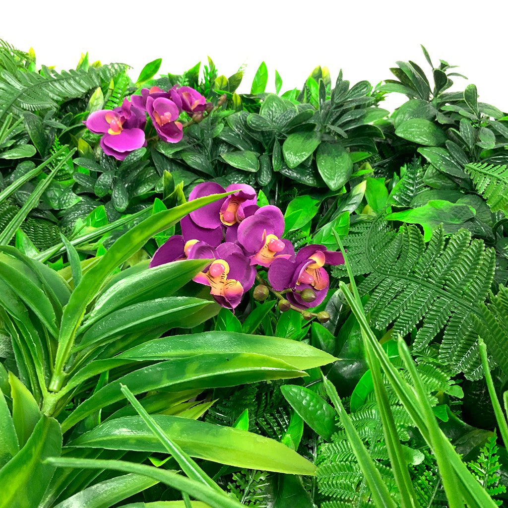 Artificial green foliage wall panel with purple orchids and mixed leaf textures