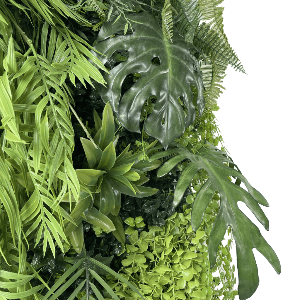 Artificial jungle plant wall panel with layered green tropical leaves and vines