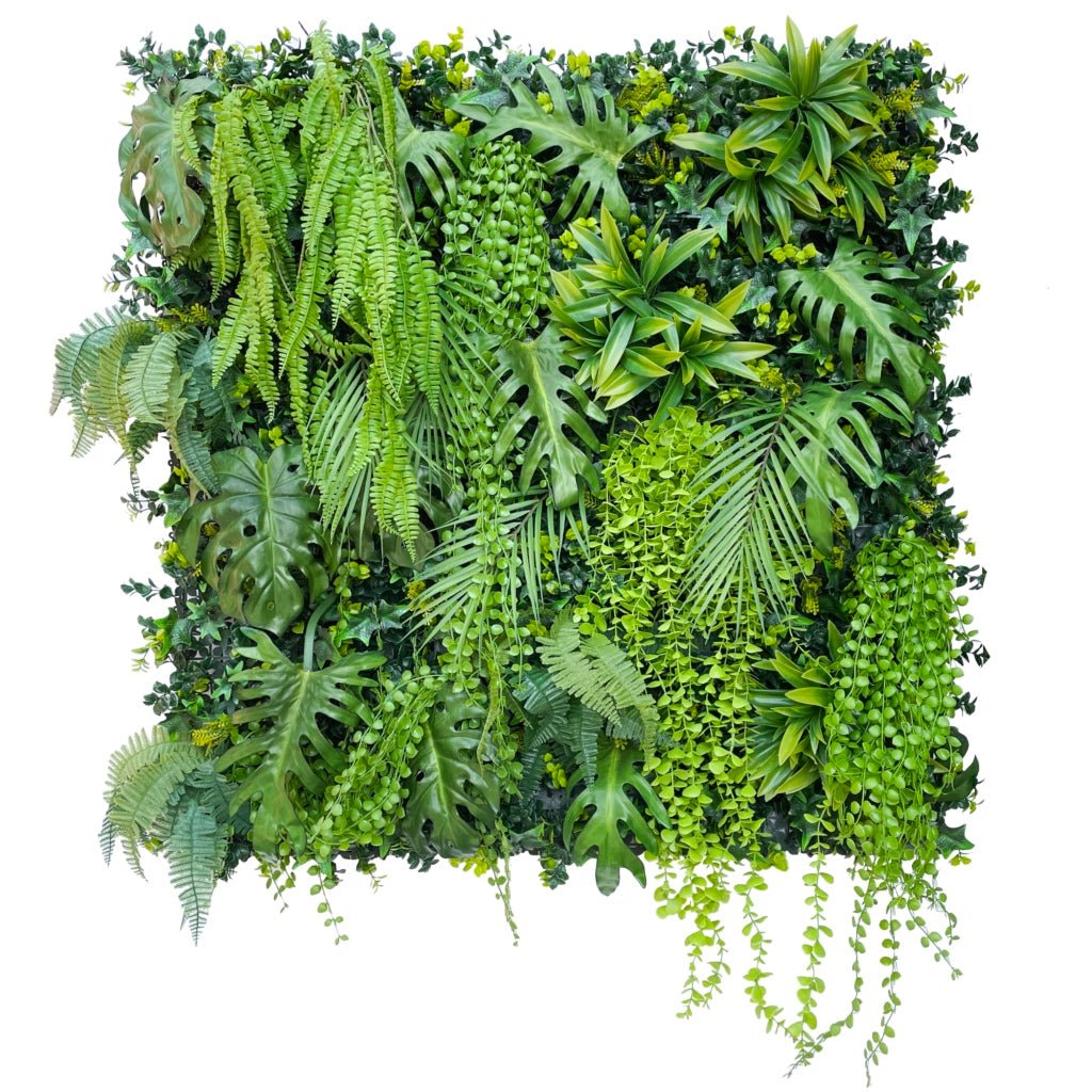 Artificial tropical plant wall with dense green leaves, ferns, and trailing clusters