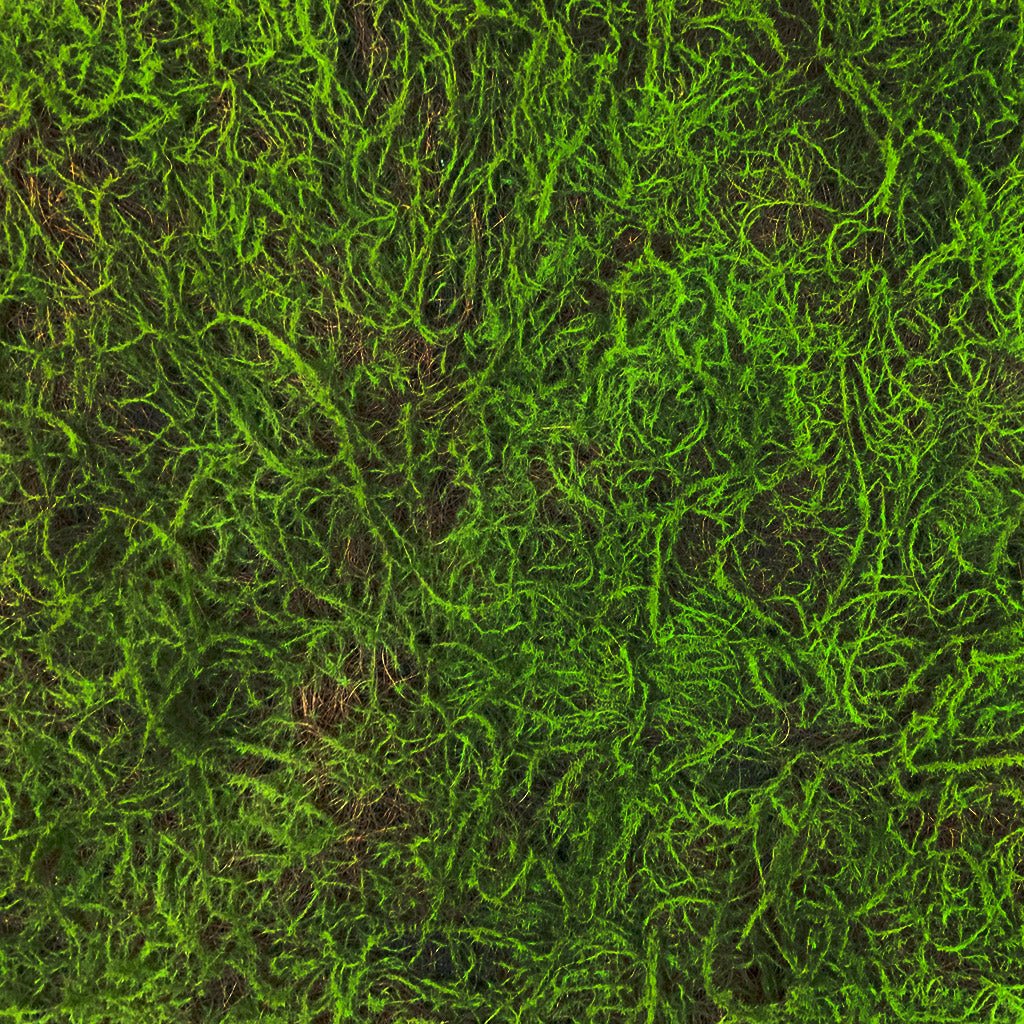 Artificial green sphagnum moss panel close-up, thick shaggy green fibers