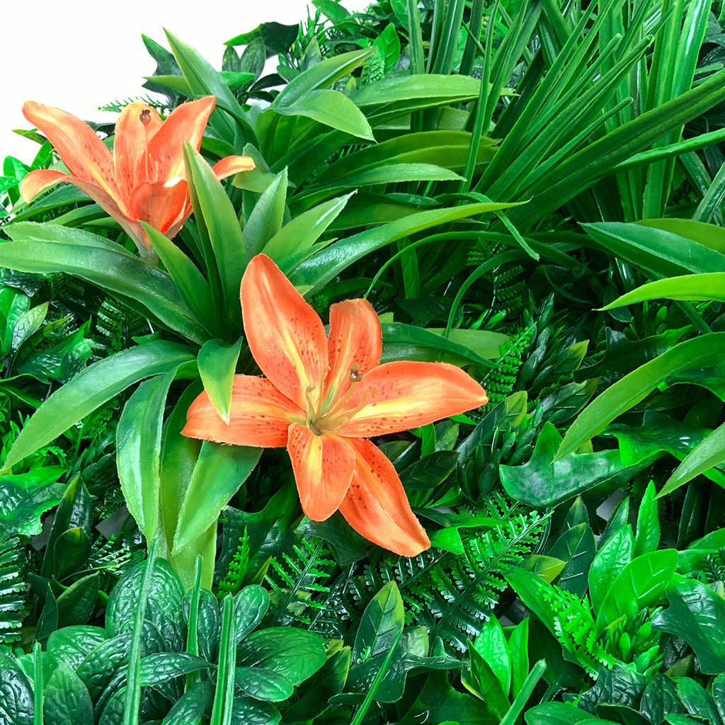 Artificial green foliage wall panel with orange tiger lily flowers and layered leaves