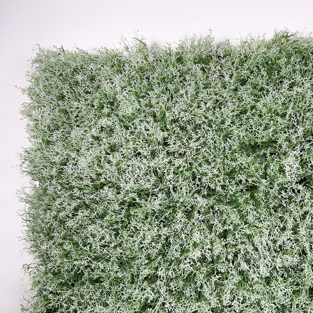 Artificial moss panel with dense light and green tufted texture, square shape.