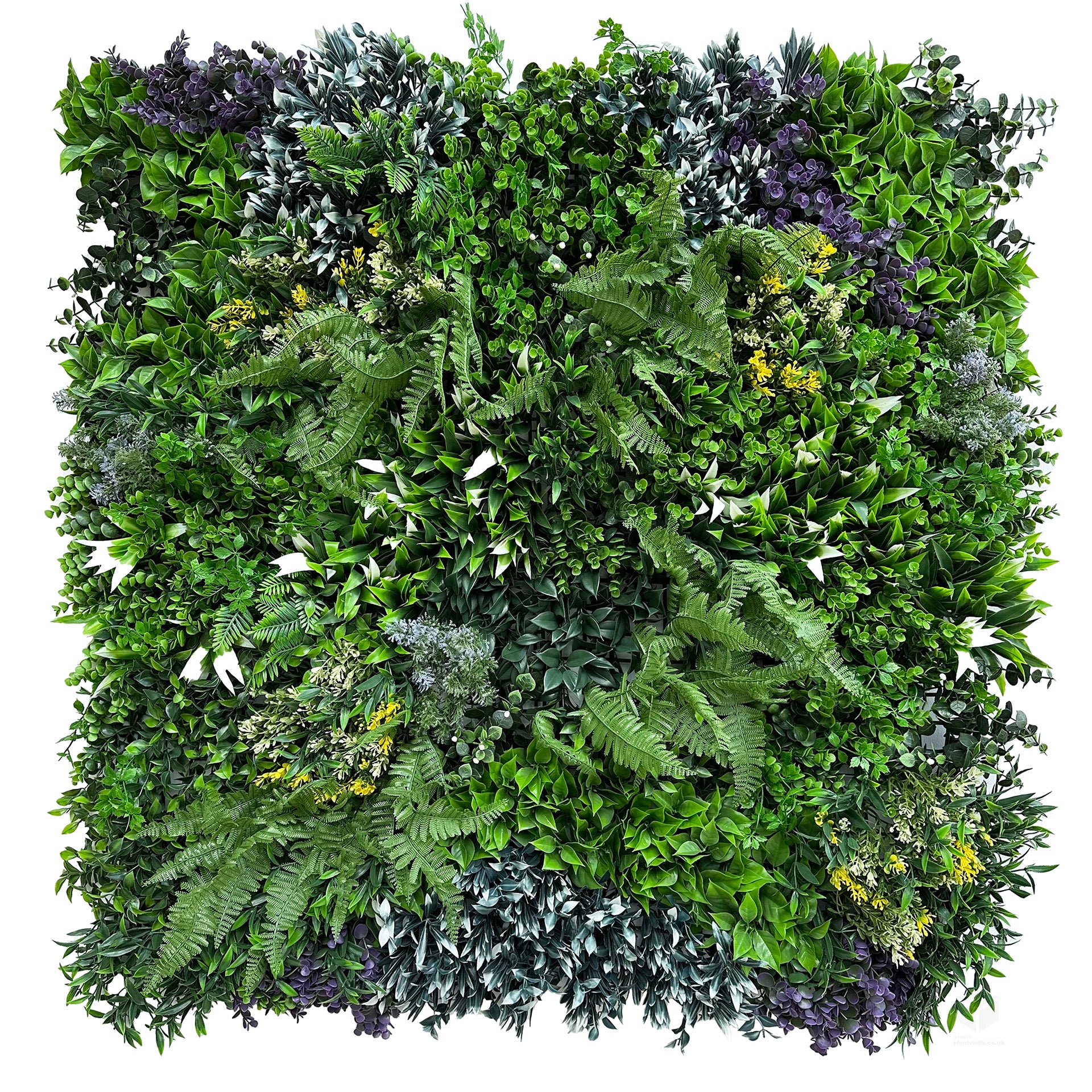 Artificial green wall panel with dense green leaves and small purple accents, against a white background