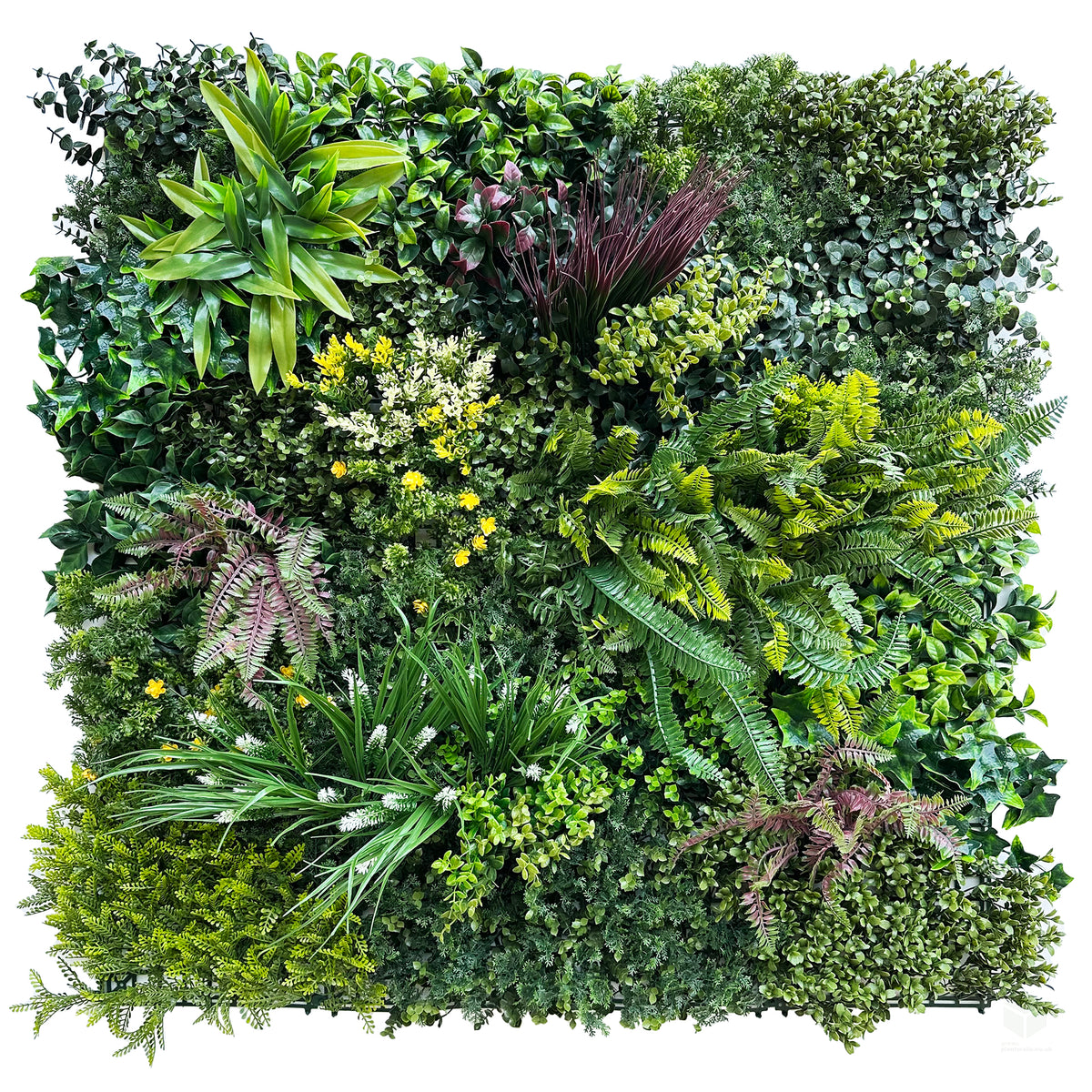 Artificial green wall panel with dense mixed foliage, fern and leafy plants, small yellow accents