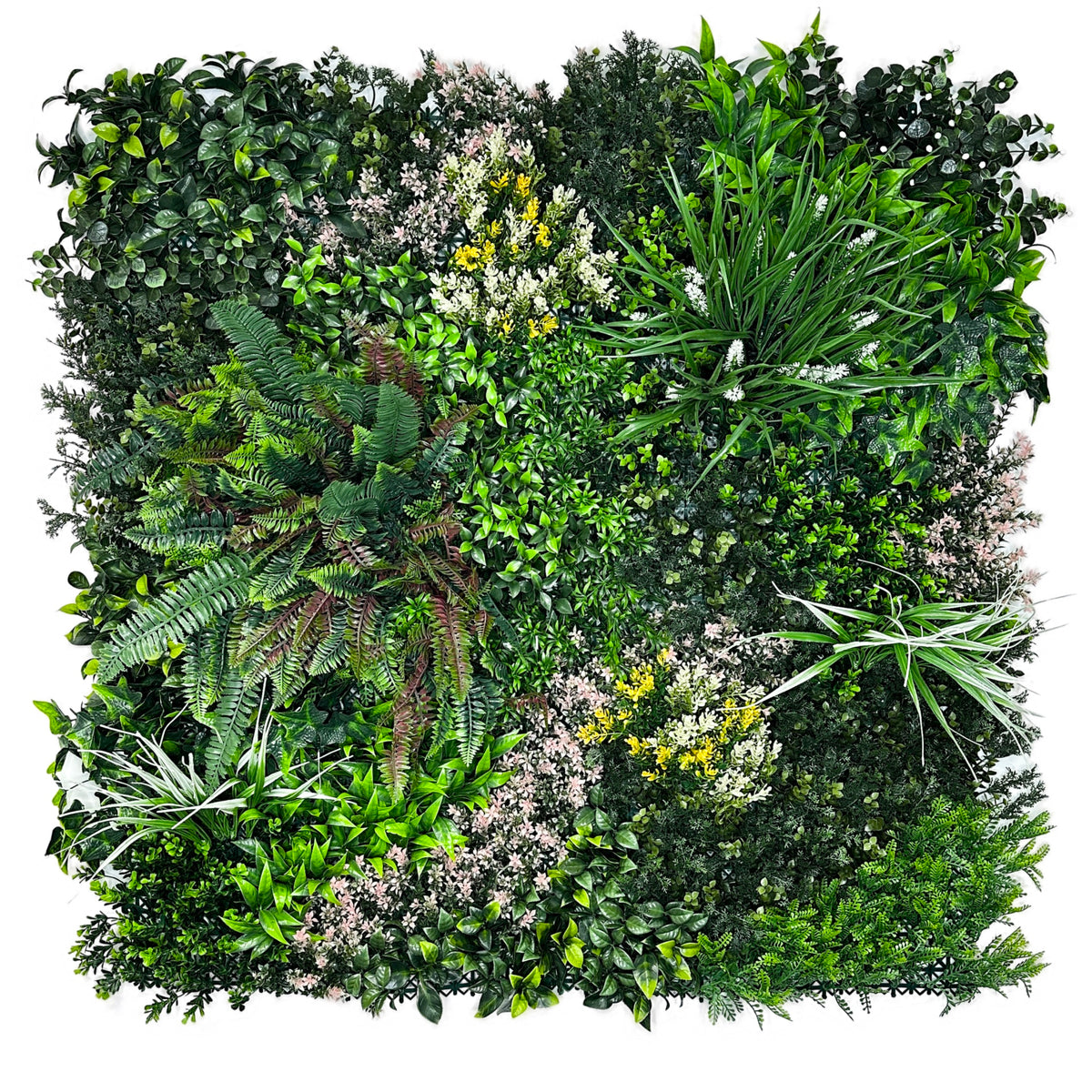 Artificial green foliage wall panel with layered leaves, white flowers, and small yellow accents