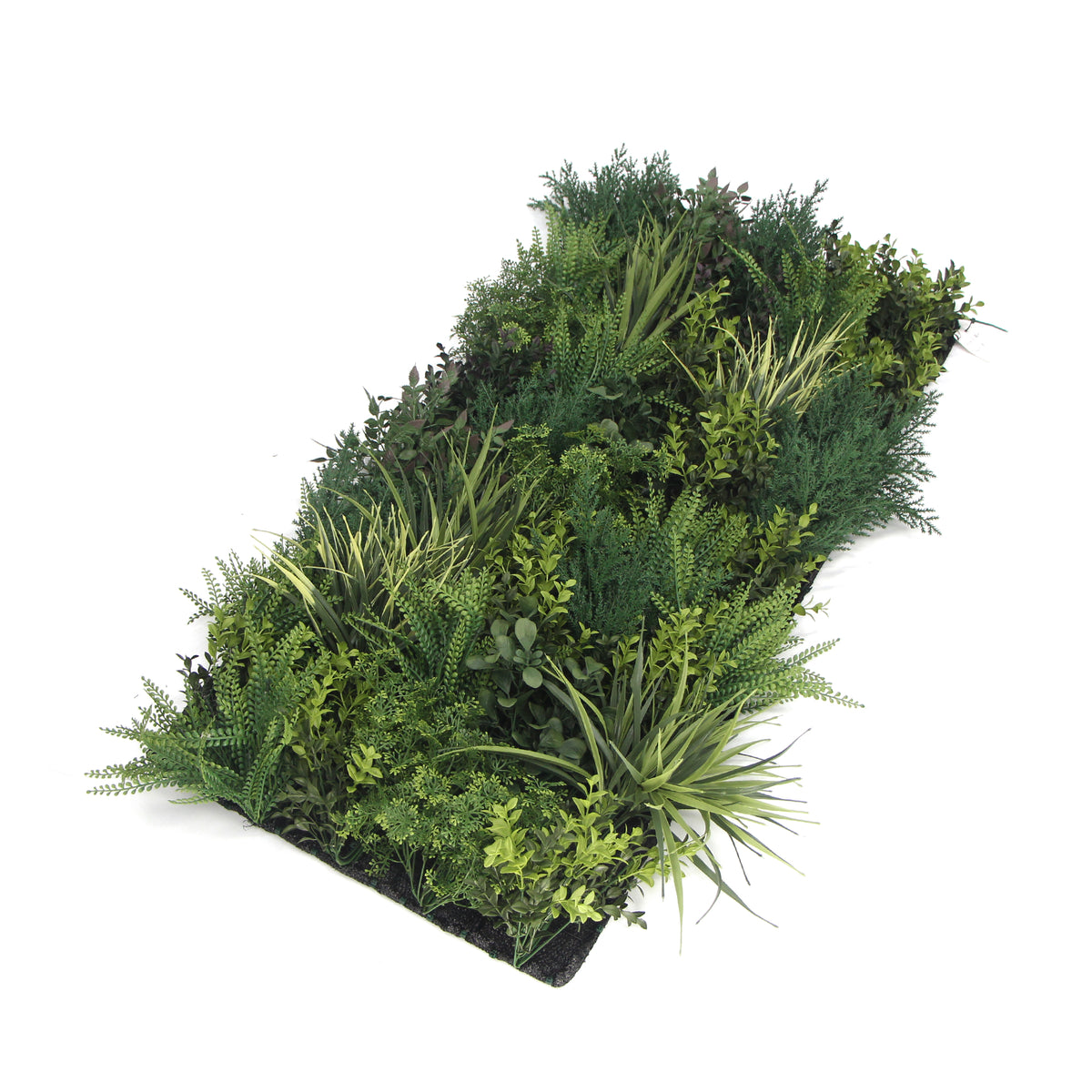Artificial foliage wall panel with varied green leaves and fern-like fronds, angled