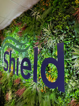 Artificial green wall panel with mixed green orange red and white foliage, white and yellow flowers 100x100 cm