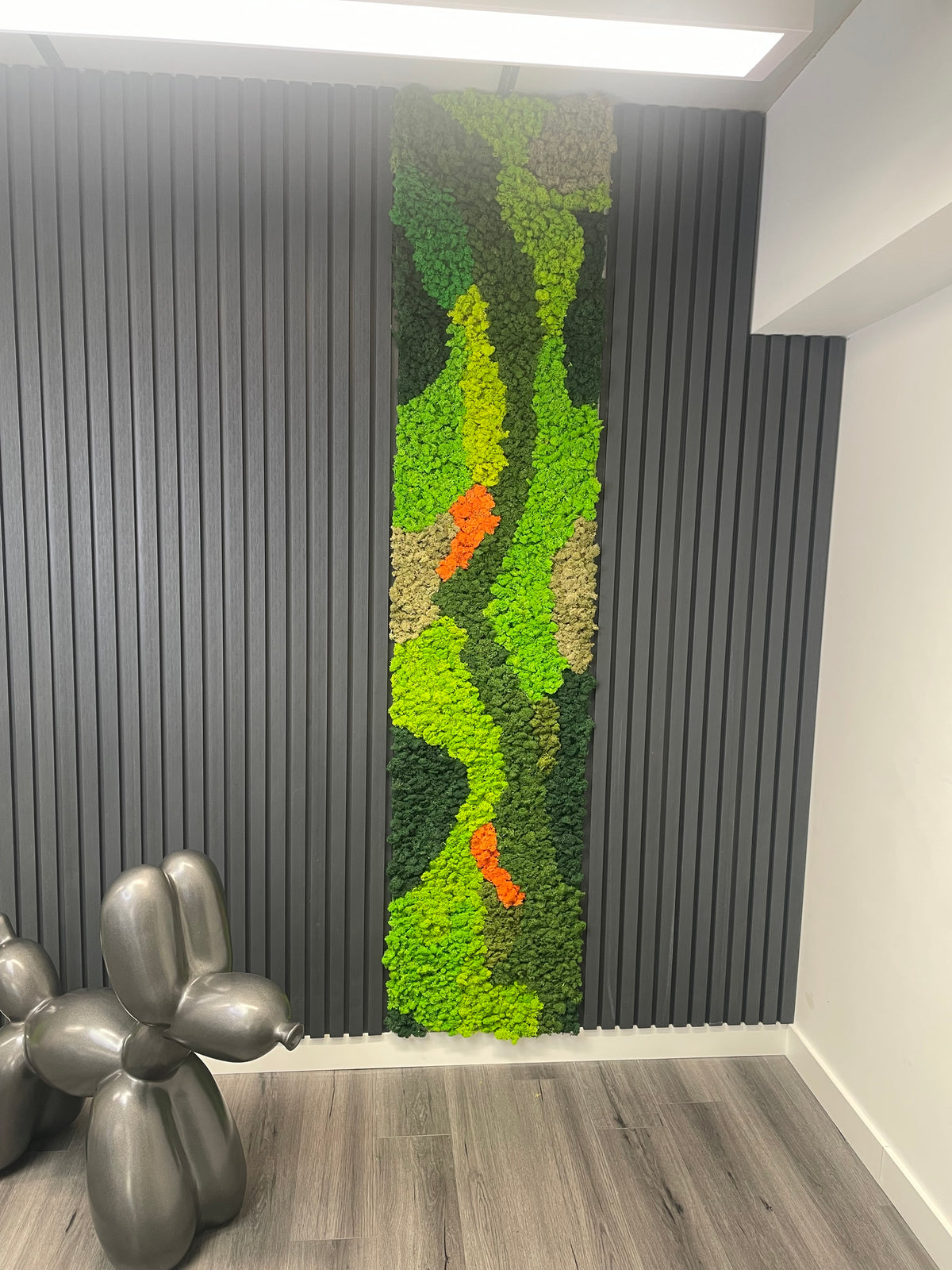 Preserved reindeer moss panel with lime green zigzag texture, beige base, and orange accents.